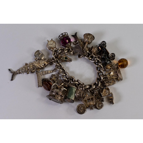 756 - Large & heavy silver charm bracelet, gross weight 171g gross.