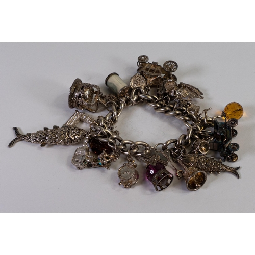 756 - Large & heavy silver charm bracelet, gross weight 171g gross.