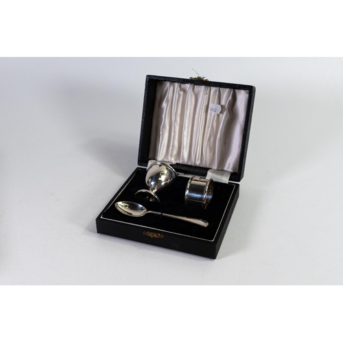 761 - Cased hallmarked silver christening set includes Egg cup spoon & napkin / serviette ring.