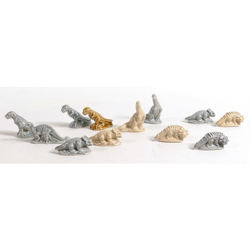 391 - A collection of Wade dinosaur hollow Whimsies in two different colours. These were removed from the ... 