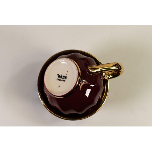 460 - Wade burgundy and gilded coffee set to include 8 cups & saucers, coffee pot, cream jug and sugar bow... 