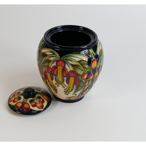 505 - Moorcroft Fuchsia and Berry pattern lidded pot. Height 16cm, dated 2004. Boxed