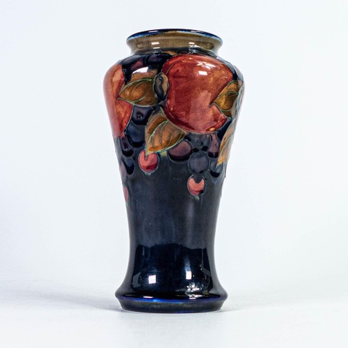 552 - William Moorcroft vase decorated in the Pomegranate design, h.18.25cm.