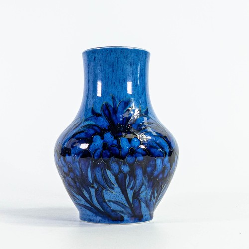 569 - William Moorcroft vase with Cornflower design on powder blue ground c.1920, restoration to top rim a... 