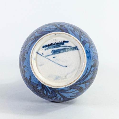 569 - William Moorcroft vase with Cornflower design on powder blue ground c.1920, restoration to top rim a... 