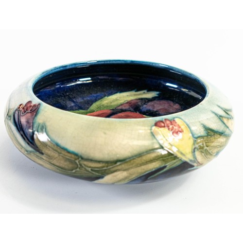 571 - William Moorcroft lipped bowl with Pansy design, restoration top rim, crazing c.1925