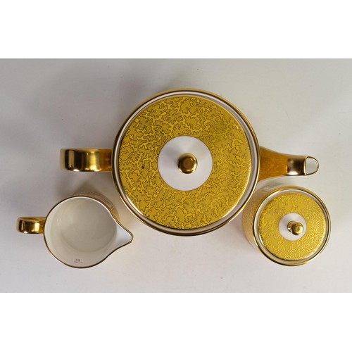 602 - Lynton Fine Porcelain tea set comprising tea pot, covered sugar and milk jug, gilded on yellow groun... 