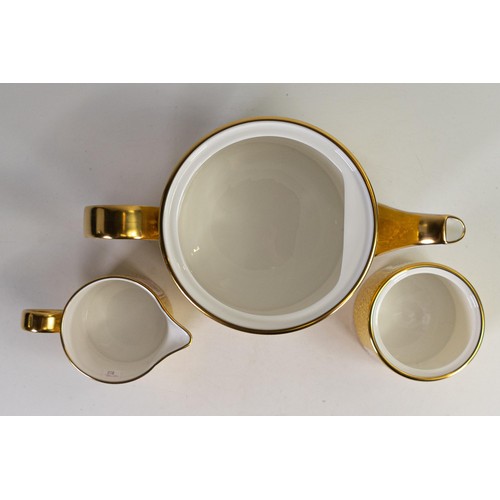 602 - Lynton Fine Porcelain tea set comprising tea pot, covered sugar and milk jug, gilded on yellow groun... 