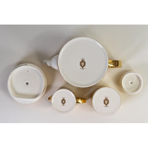 602 - Lynton Fine Porcelain tea set comprising tea pot, covered sugar and milk jug, gilded on yellow groun... 