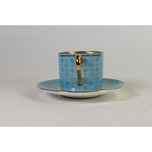 606 - Lynton Fine Porcelain coffee can & saucer, gilded on light blue ground, hand painted with flowers by... 