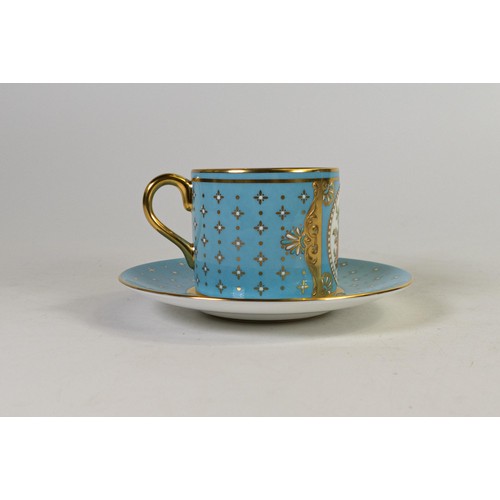 606 - Lynton Fine Porcelain coffee can & saucer, gilded on light blue ground, hand painted with flowers by... 