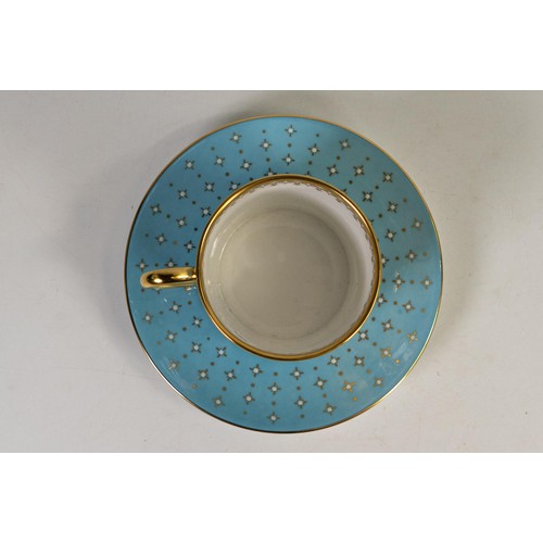 606 - Lynton Fine Porcelain coffee can & saucer, gilded on light blue ground, hand painted with flowers by... 