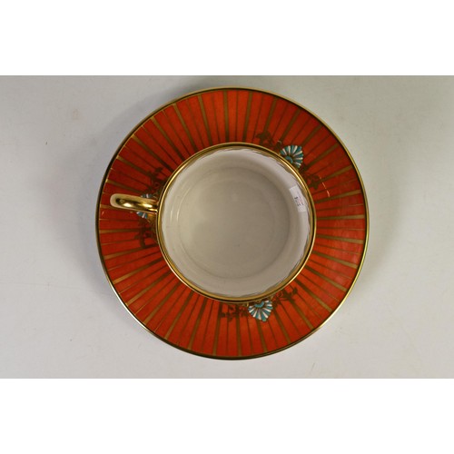 607 - Lynton Fine Porcelain coffee can & saucer, gilded on orange ground, hand painted with flowers by Ste... 