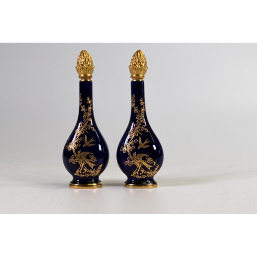 610 - Lynton Fine Porcelain pair of scent bottles and stoppers, gilded with birds on dark blue ground by S... 