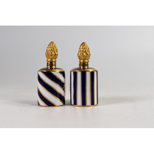 611 - Lynton Fine Porcelain pair of scent bottles & covers, gilded on dark blue ground, hand painted with ... 