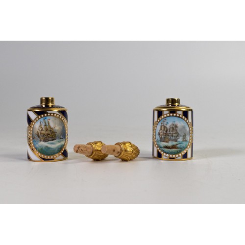 611 - Lynton Fine Porcelain pair of scent bottles & covers, gilded on dark blue ground, hand painted with ... 