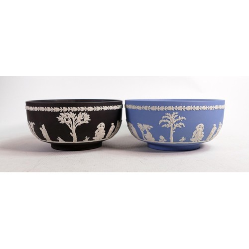 628 - Two Wedgwood Jasper ware fruit bowls, one in black and the other pale blue. Measure 20cm in diameter... 