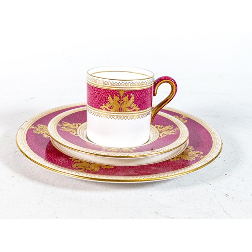 653 - Wedgwood pink & gilt decorated coffee can trio (3)