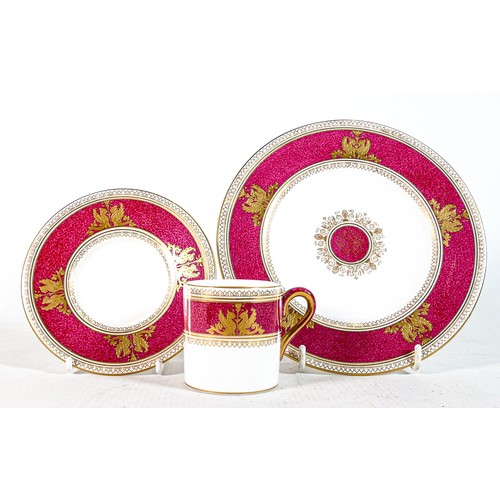 653 - Wedgwood pink & gilt decorated coffee can trio (3)