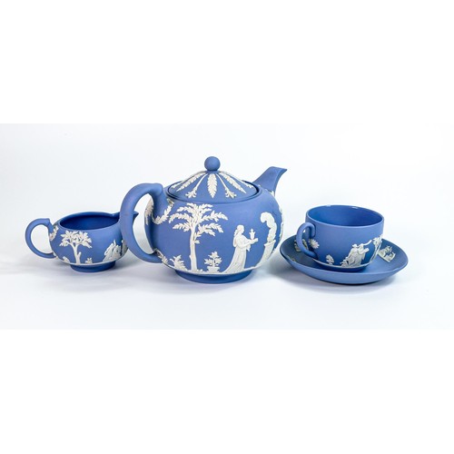 662 - Wedgwood blue Jasper ware tea pot, cream jug & cup/saucers set. (4)