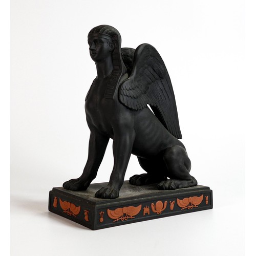 666 - Wedgwood black Basalt model of a Sphinx with terracotta Egyptian designs, dated 1973, h.22.5cm.