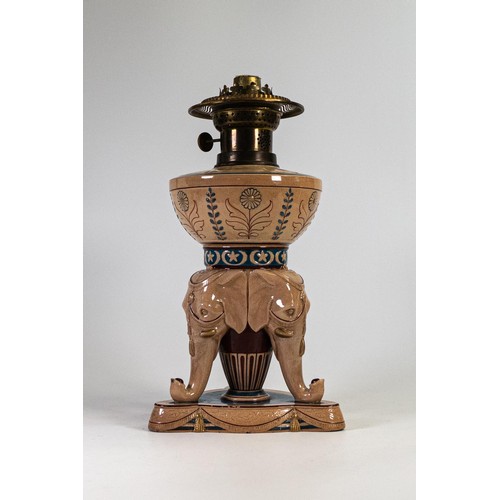 679 - 19th century Wedgwood Majolica lamp base with three elephant circus masks, Martins patent brass burn... 