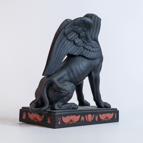 685 - Wedgwood black Basalt model of the Sphinx on rectangular base, terracotta sprigged with Egyptian mot... 