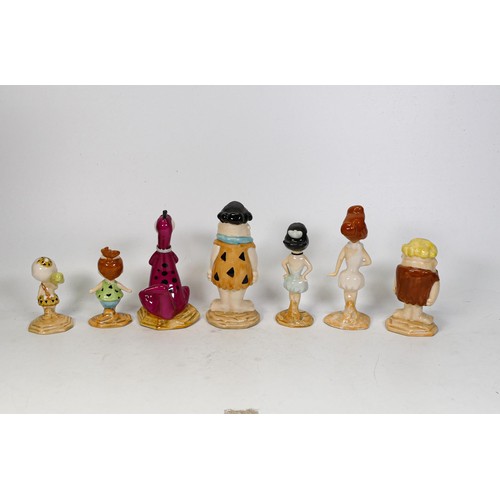 697 - A collection of Beswick Flintstones figures Fred and Wilma, Pebbles Flintstone, Barney and Betty, Ba... 