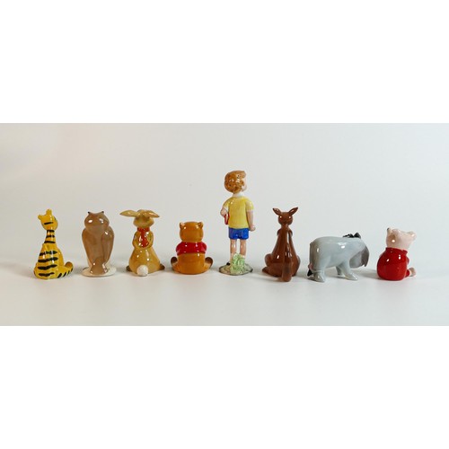 701 - Beswick Winnie the Pooh characters comprising - Christopher Robin, Winnie the Pooh, Tigger, Piglet, ... 