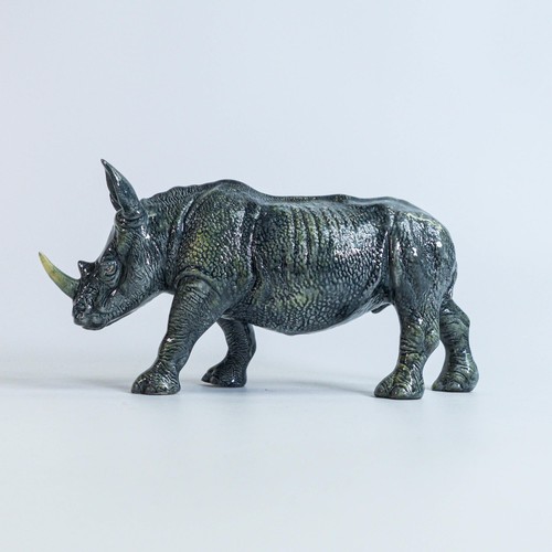 773 - A Beswick England prototype figure of a Rhinoceros c2006, height 11cm, length 22 small chip to the h... 