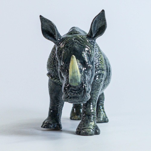 773 - A Beswick England prototype figure of a Rhinoceros c2006, height 11cm, length 22 small chip to the h... 