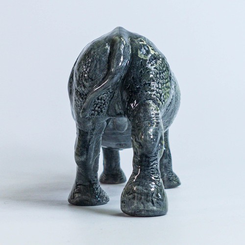 773 - A Beswick England prototype figure of a Rhinoceros c2006, height 11cm, length 22 small chip to the h... 