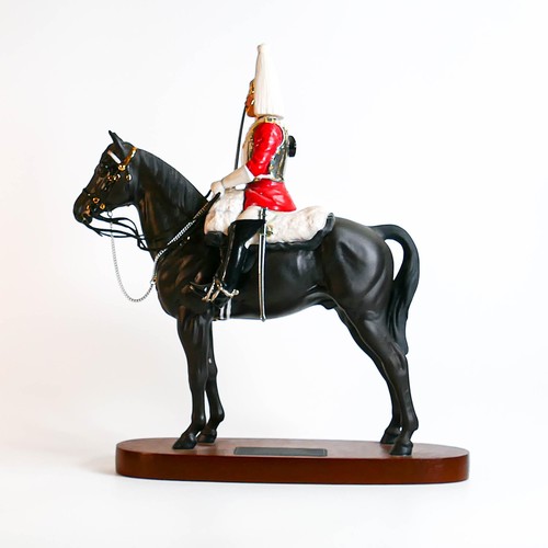 826 - Beswick Connoisseur Lifeguard on horse 2562 on wooden plinth.