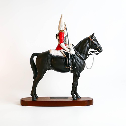 826 - Beswick Connoisseur Lifeguard on horse 2562 on wooden plinth.