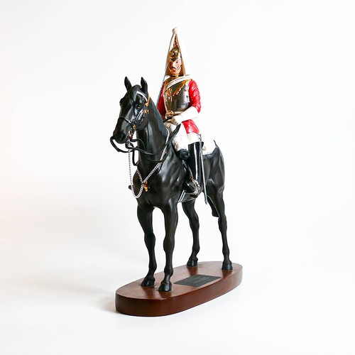 826 - Beswick Connoisseur Lifeguard on horse 2562 on wooden plinth.