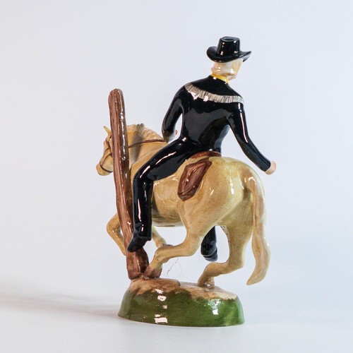 828 - A prototype Beswick figure of cowboy on horseback, modelled by Michael Sutty for a Western Series in... 