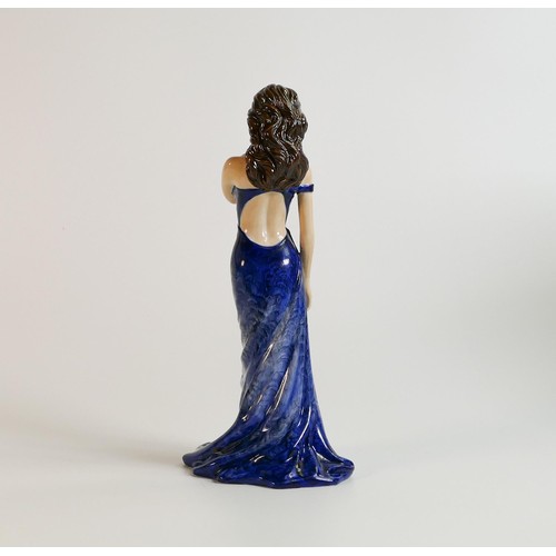 1002 - Royal Doulton prototype figure of lady in blue dress with gilded decoration, h.23cm.