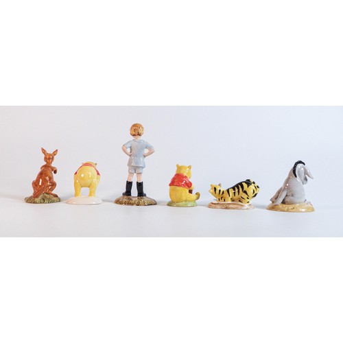 1020 - Royal Doulton Winnie the Pooh figures for the 70th Anniversary to include Christopher Robin, Eeyore,... 