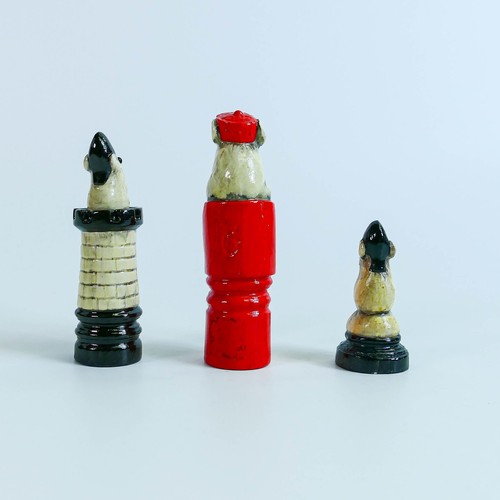 1030 - Doulton Stoneware George Tinworth chess pieces of Red Queen, Black Rook and
Black Pawn, impressed Do... 