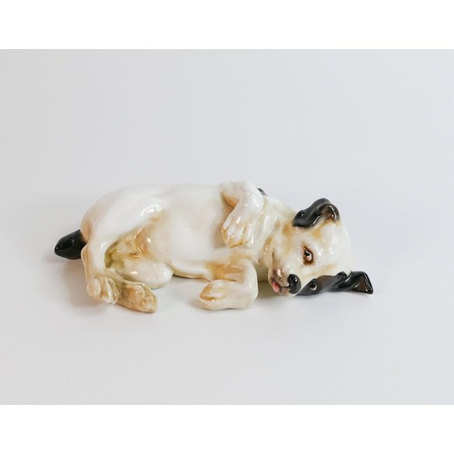 1072 - Royal Doulton early model of puppy laying down, impressed date for 1930, a/f - hairline cracks to pa... 