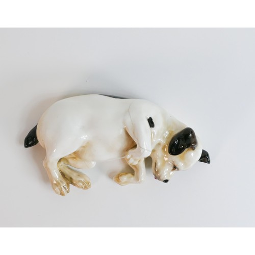 1072 - Royal Doulton early model of puppy laying down, impressed date for 1930, a/f - hairline cracks to pa... 