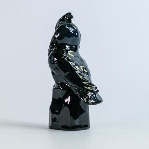 1089 - A Royal Doulton figure of a Cockatoo on a Rock HN191 in an unrecorded black colourway, dated 1926, h... 