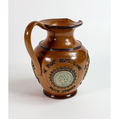 1140 - Doulton Lambeth Stoneware motto ewer decorated all around with various round portrait panels, 