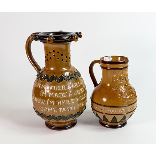 1141 - Doulton Lambeth Stoneware puzzle jug and a similar Bacchus drinking jug, tallest h.23cm, c1880s. Sma... 