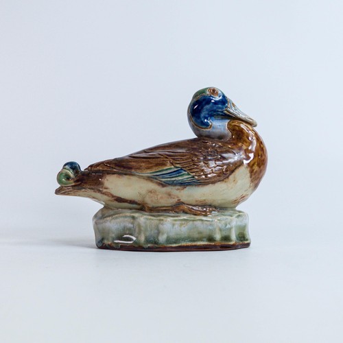 1207 - Royal Doulton Stoneware model of a duck designed by Harry Simeon, Model No.539, resting on an oval b... 