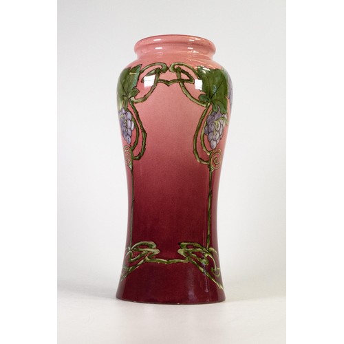 1243 - Doulton Lambeth Faience vase decorated with Art Nouveau stylised flowers on pink ground, artist sign... 