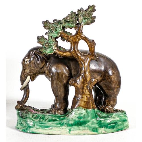 1432 - Early 19th century Staffordshire figure of elephant with bocage, decorated in overglaze enamels. Los... 