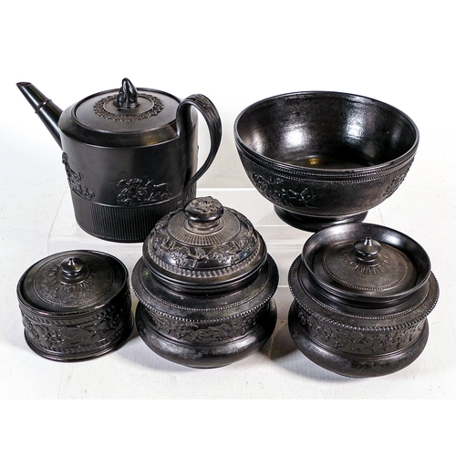 1439 - A collection of 19th century black Staffordshire ware including teapot, lidded pots bowl etc. (5)