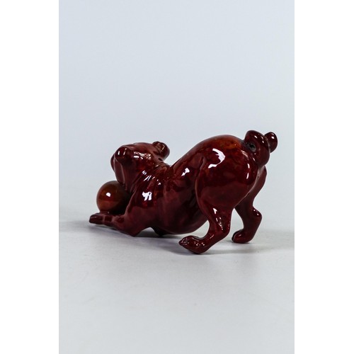 1507 - Bernard Moore mottled Flambe model of a dog with ball, h.5.5 x L11cm.