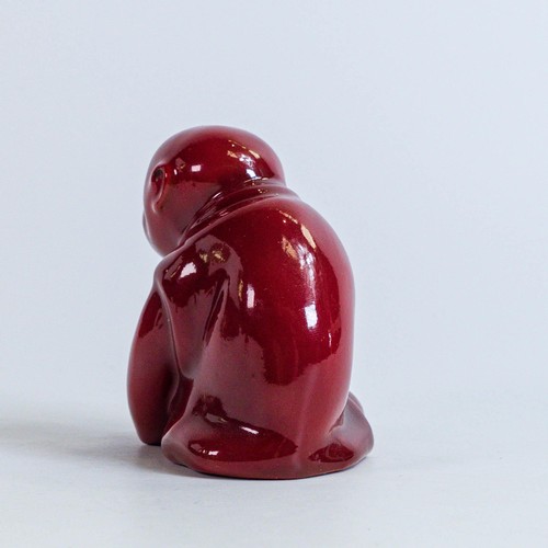 1557 - Bernard Moore seated monkey in a red Flambe glaze, height 8cm